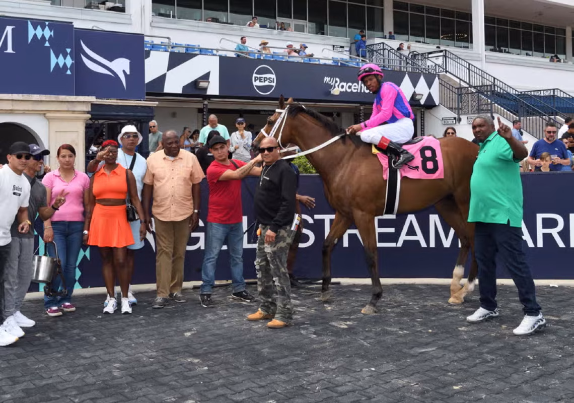 Trainer Christopher Hall (right) with War To Remember. The jockey is Anthony Thomas.